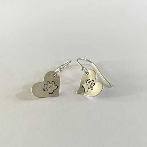 silver heart with a paw print on it , Dangle style earrings