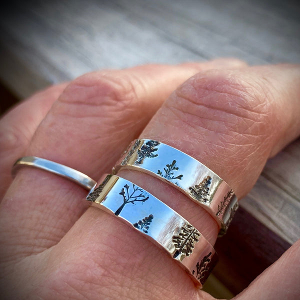 Two Trees Rings shown together on one finger