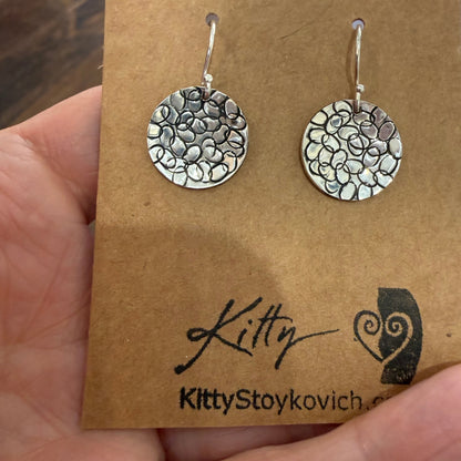 Circle with Dots Design Earrings in Sterling Silver on earring card