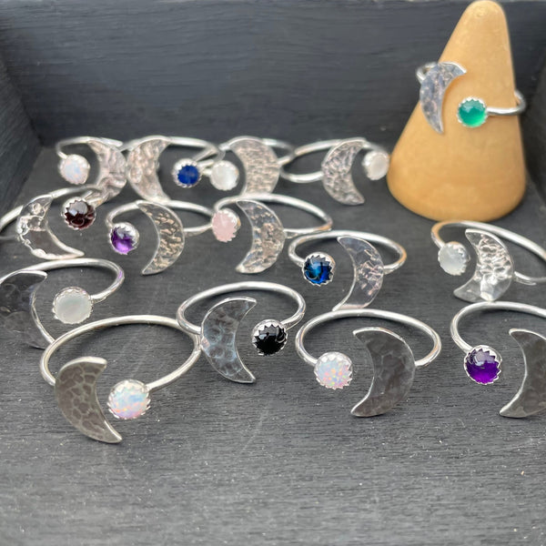Moon rings showing a wide variety of stones set in them.
