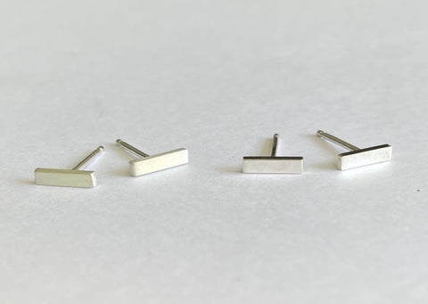 silver bar post earrings shown in matte on the left and shiny on the right