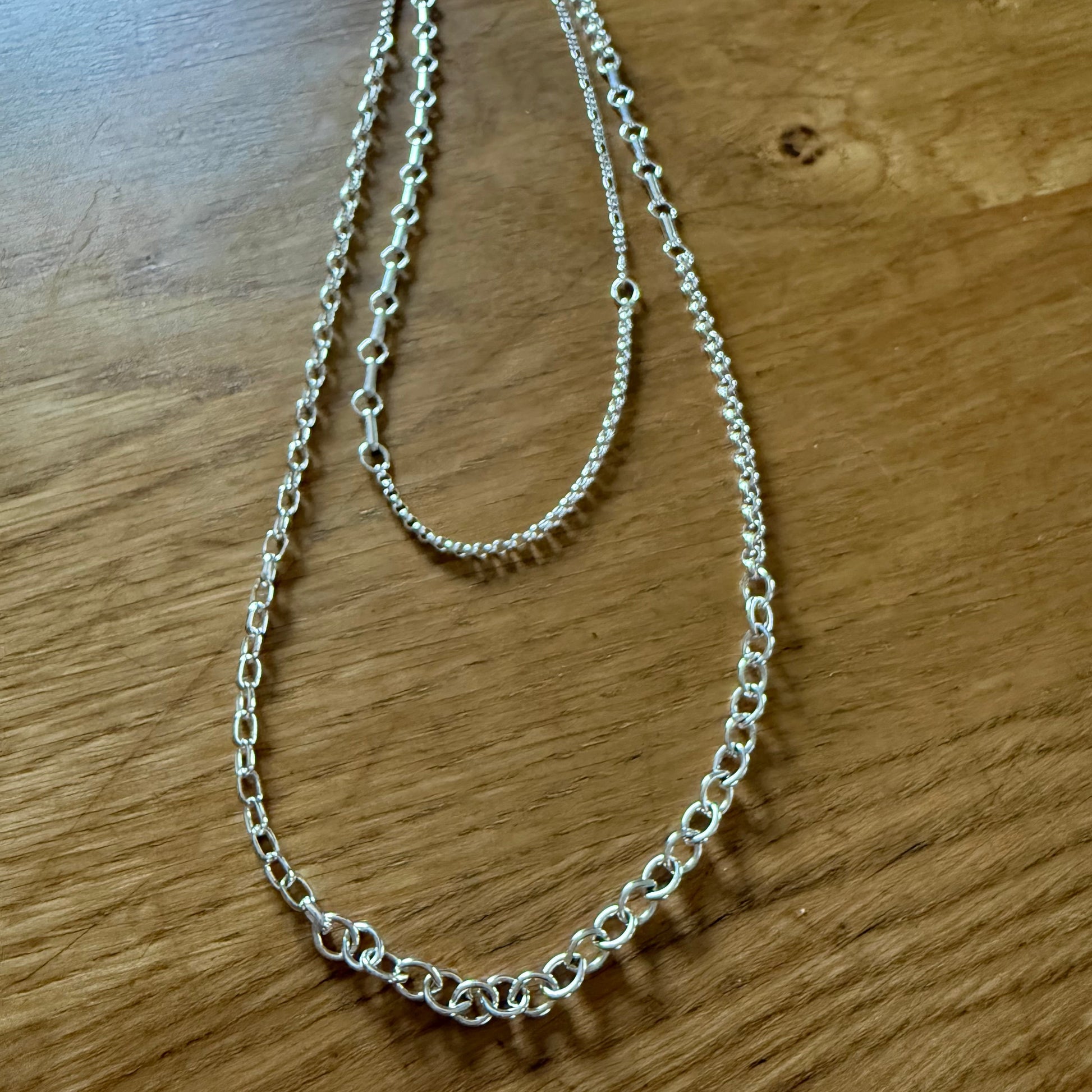 Mixed links silver chain that is 36" long