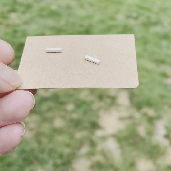 video of matte finish bar post earrings on a card