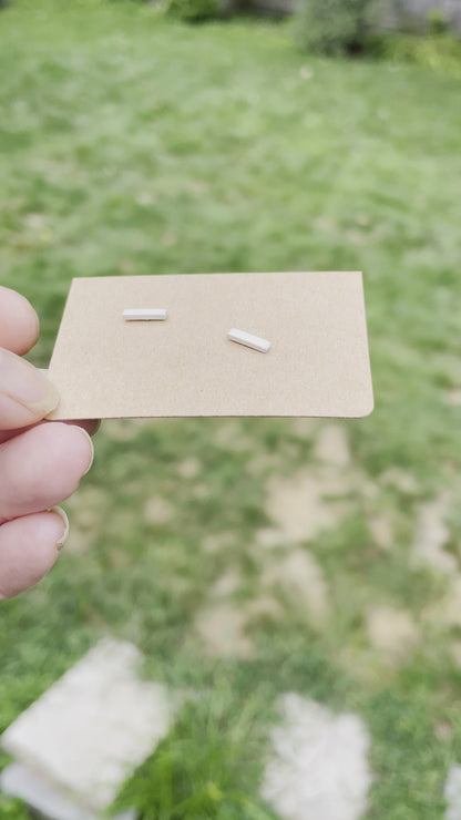 video of matte finish bar post earrings on a card