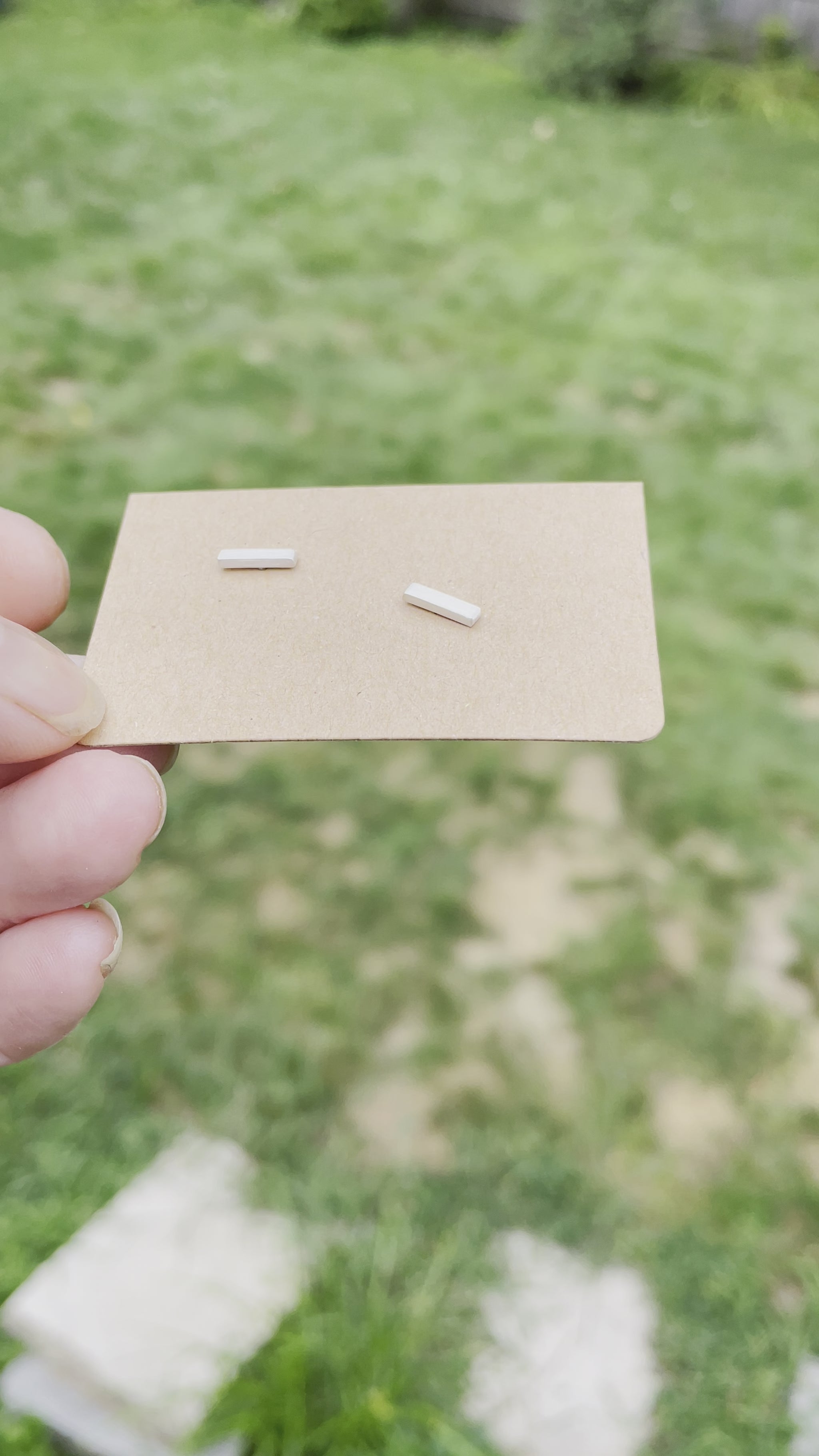 video of matte finish bar post earrings on a card