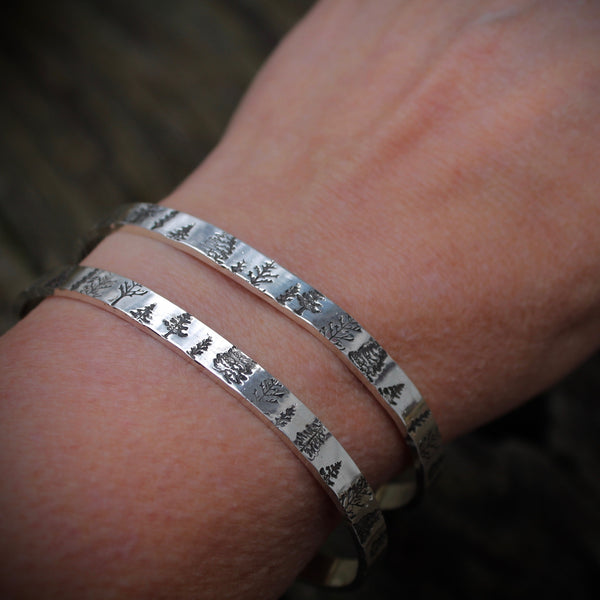 Two trees Bracelets shown on wrist in silver