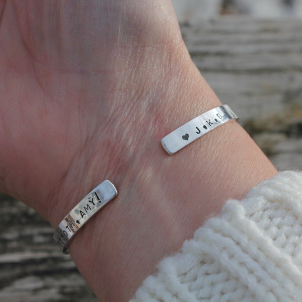 Personalized Trees bracelet on wrist showing the underside with birthday message and heart with initials