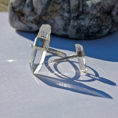 Large crystal ring next to small crystal ring for size comparison