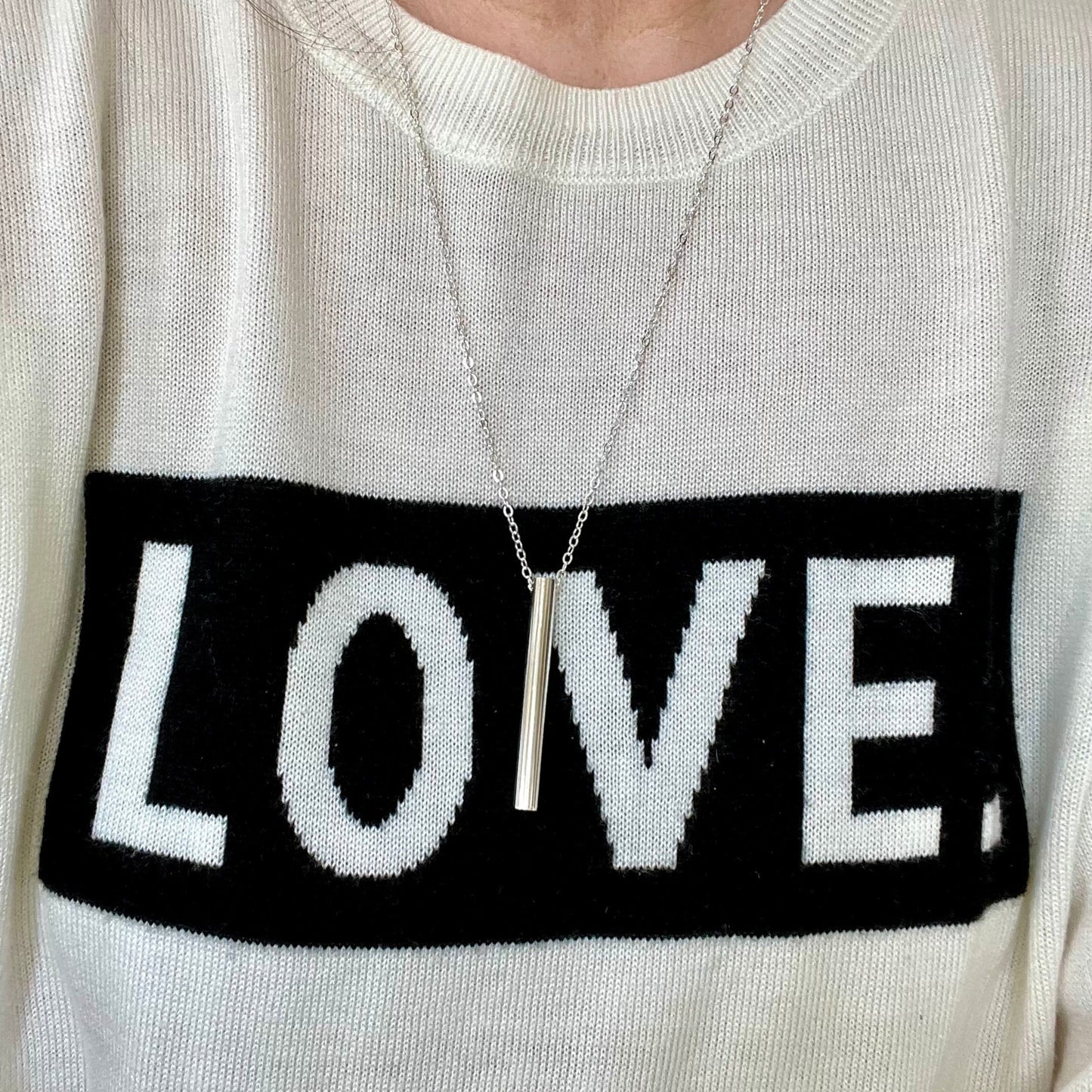 Breathing tool necklace worn to show cable style chain look and length