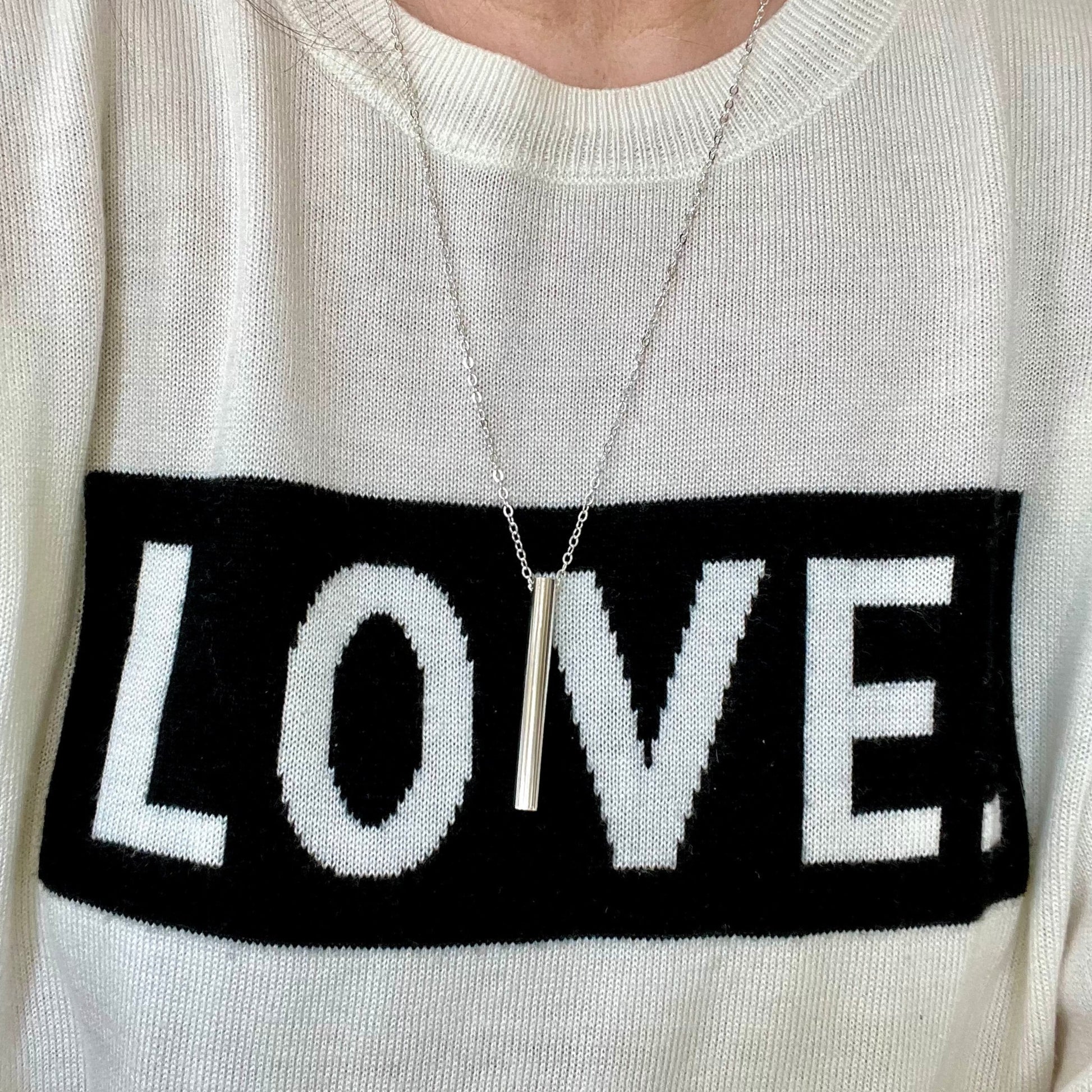 Breathing tool necklace worn to show cable style chain look and length