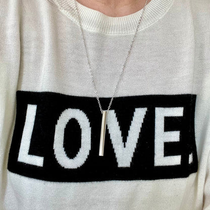 Breathing tool necklace worn to show cable style chain look and length