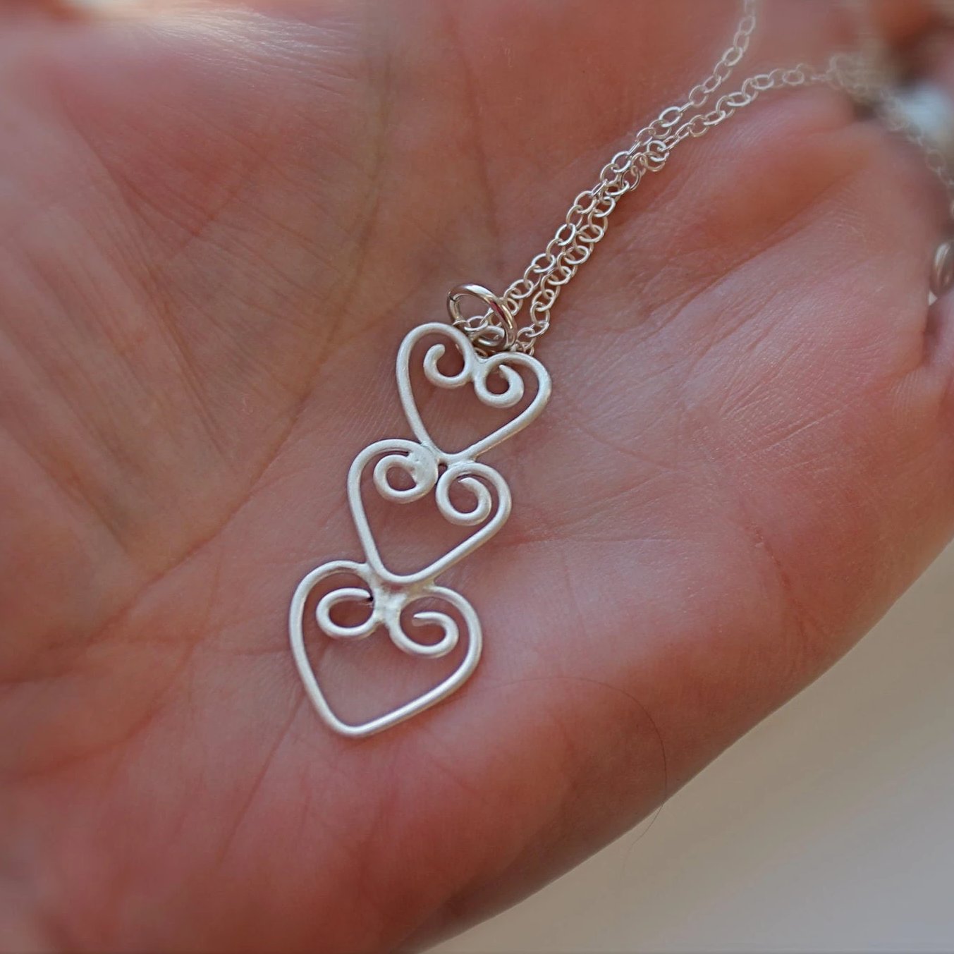 Three Hearts Connected Necklace in Silver