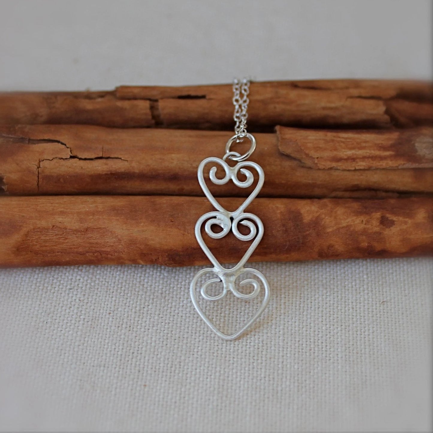 Three Hearts Connected Necklace in Silver