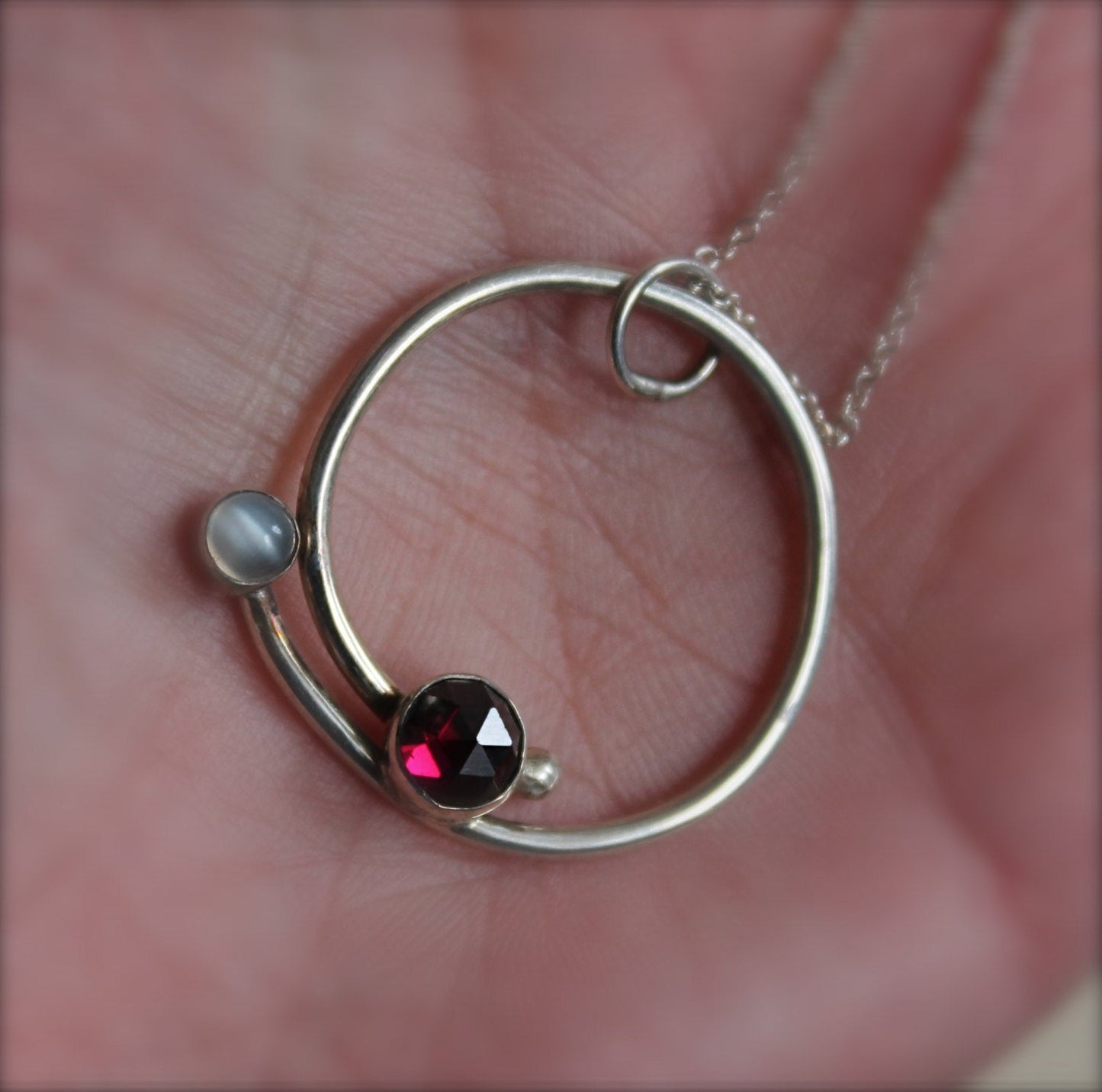 Circle with Rose Cut Garnet and Moonstone Pendant in Silver