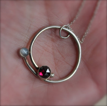 Circle with Rose Cut Garnet and Moonstone Pendant in Silver