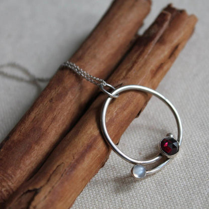 Circle with Rose Cut Garnet and Moonstone Pendant in Silver