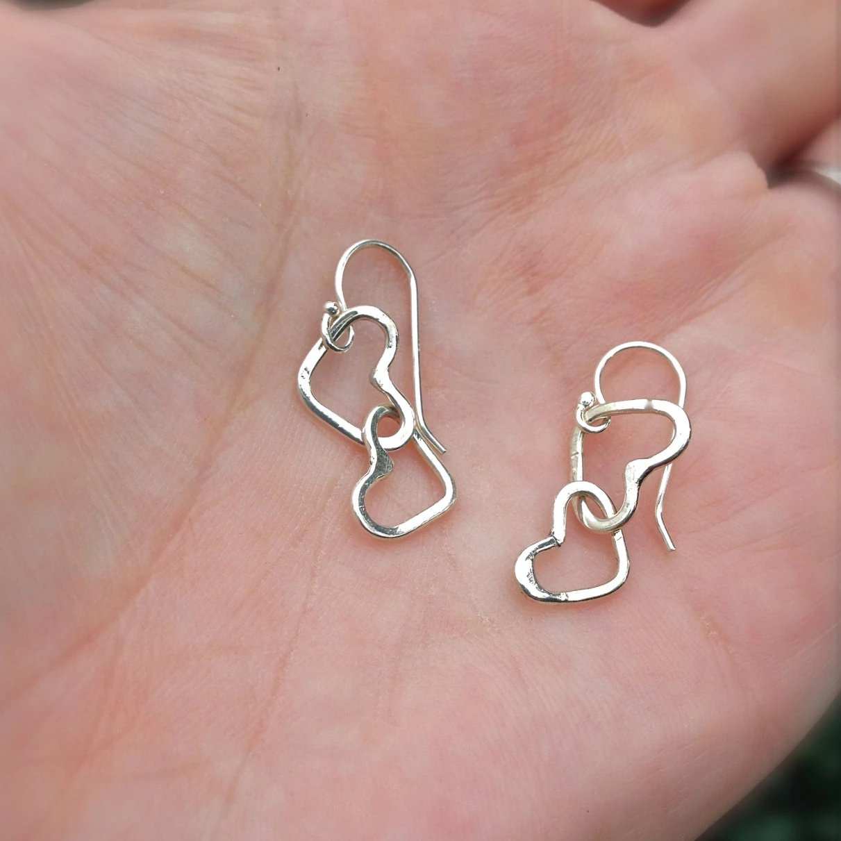 Hearts Linked Together Earrings in Silver