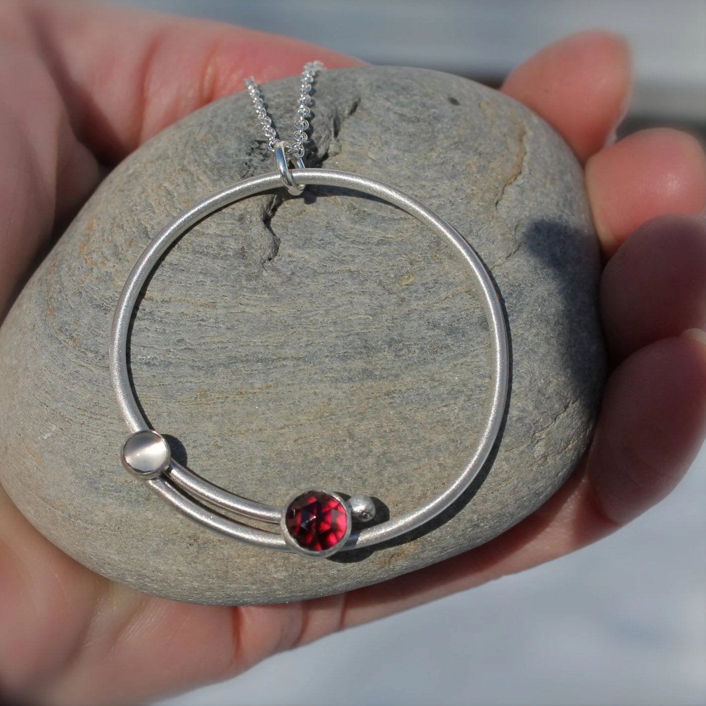 Circle with Rose Cut Garnet and Moonstone Pendant in Silver
