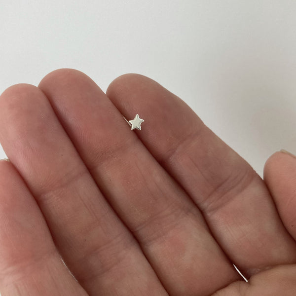 Star Nose Ring in Sterling Silver shown on hand